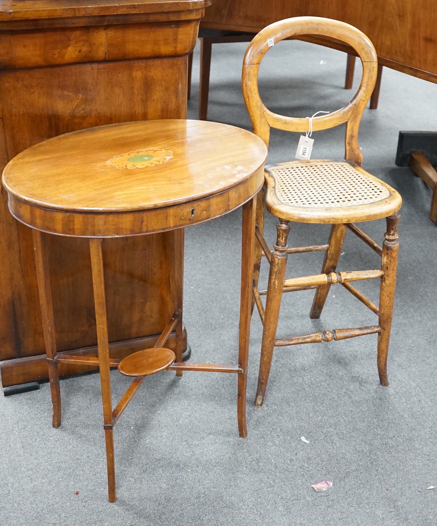 A Victorian caned beech child's correction chair and an Edwardian inlaid mahogany oval occasional table